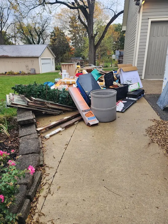 Dumpster being loaded with debris for Residential Dumpster Rental in Fairborn